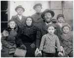 Portrait of a religious Transcarpathian Jewish farmer, his wife and six of his children.