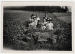 Irma R. Simon, left at rear, and son Steven Simon in front, third from right, picking peas with their landlord's family during the summer of 1942 while assigned to "forced residence" in Allegre in the Auvergne by the Vichy government.