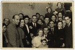 Group portrait of adults and children in the Lodz ghetto.