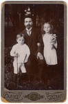 Studio portrait of a Polish Jewish family sent to a relative as a Jewish New Year's card.