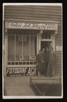 Adolph and Hania Gartenberg and two others stand in front of their photo studio in Przemysl.