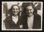 Two teenage Jewish girls pose on a street in Chelm.
