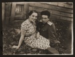 Abram and Estera (Ajzen) Lewin sit outside a wooden cabin in Gorky.