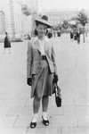 Feigele Peltel (now Vladka Meed), a courier for the Jewish underground on the "Aryan side" of Warsaw, poses in Theater Square (Plac Teatralny).