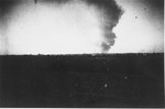 Smoke rises over Warsaw from the burning ghetto.  The view is from the neighborhood of Kolo.