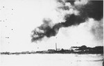 Smoke rises over Warsaw from the burning ghetto.  The view is from the neighborhood of Kolo.