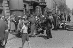 Jews purchase produce from street vendors in the Warsaw ghetto.
