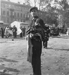 A man offers sweaters for sale at an open air market in the Warsaw ghetto.