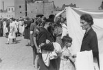 Jews shop at an open air market in the Warsaw ghetto.