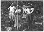 Felix Koch (left) and his workers prepare to drill in the forests near Sosua.