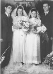 Double wedding portrait of Israel and Zlata (Distel) Malcmacher (right) and Motel and Lola (Rolnik) Malcmacher (left).