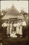Members of a Zionist group pose in front of a wooden gazebo in the Kabacznik garden.