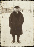 Portrait of Pinhas Paikowski on a snowy street in Eisiskes.