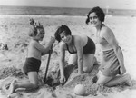 Doris Bloch and her cousin Annelise Hollander play in the sand at the beach.