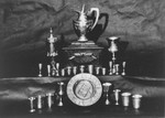 Display of confiscated silver kiddish cups and other Jewish religious articles.