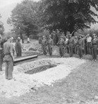 American soldiers provide a military burial for a Soviet colonel who had been imprisoned in Ebensee and died from tuberculosis.