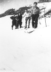 Jewish refugees ski near Valle Stura, Italy after crossing over the border from France.