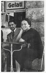A young Jewish couple from Poland sits outside an ice cream parlor in Pisa, Italy.