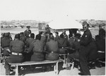 Members of the 2nd Polish Corps (Anders Army) attend an outdoor class at their military base in the Iraqi desert, where they were stationed from the summer of 1942 until the summer of 1943.