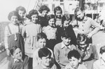 Group portrait of German Jewish refugee children on the deck of the SS Orama while en route to Australia.