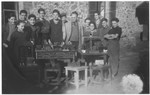 Group portrait of Jewish boys in the carpentry workshop of the Montintin children's home.