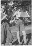 Charles Roman (left) and Herbert Stubnitzer (right) play music together in the yard of the Montintin children's home.