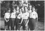 Group portrait of Jewish boy scouts in the Montintin children's home wearing shirts with wolf emblems.