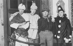 Herbert Mosheim (second from the left) poses in costume with a group of friends during a Fasching celebration.