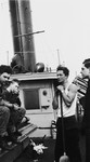 Four crew members on the deck of the President Warfield (later the Exodus 1947) in Baltimore harbor.