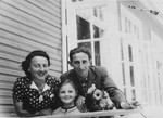 The Storch family looks over the railing of a guest house in Domaczewo.