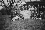 Children from the Blankenese children's home pose next to a large sign reading "the first Passover after liberation."

Among those pictured is Moniek Izbicki.