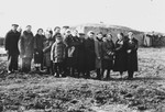 Polish Jews, exiled by the Soviets exiled to the village of Zhuravlovka, Kazakhstan, stand in front of a mud hut.