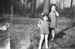 Margo and Annette Lederman, two Jewish children in hiding, play in the yard of the van Buggenhout home in Rumst, Belgium.