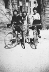 A Jewish teenager, Jacqueline Glicenstein (left), rides bicycles with two friends at a boarding school in Dole (Jura), France during the German occupation.