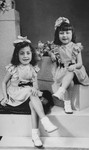 Formal portrait of Annette and Margo Lederman, two Jewish children in hiding, taken in the home of the van Buggenhout family.