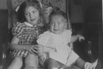 Marguerite-Rose Birnbaum (right) shares a chair with Marie-Ghislain Dincq, the daughter of her rescuer, Marie-Josephe Dincq.