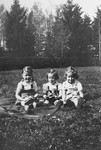 Evelyn (Evy) Goldstein, a Jewish child in hiding, poses with the children of a Nazi officer, whose family was quartered on the estate of Baroness von Huellensen in Bloestan,East Prussia during part of the period Evelyn was there.