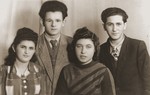 Group portrait of four young people in the Bad Reichenhall displaced persons camp.
