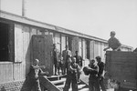 Jewish prisoners in Plaszow unload bread into part of the Madritch factory.