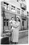 A Jewish woman poses with  her baby.

Pictured are Berte Akerman, holding Moshe Tomas.