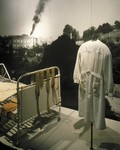 Detail of the "Murder of the Handicapped" segment, featuring a bed, blanket and doctor's smock from the Sachsenberg clinic, on the fourth floor of the permanent exhibition in the U.S.