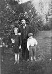 A religious Jewish family poses in a park in Mukachevo.