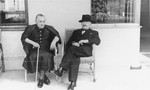 Portrait of the donor's in-laws, Ignac and Sophie Muller, sitting on their porch in Sered, Czechoslovakia.