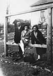 Olga (Deuts) Leier poses with her parents outside their home in Bratislava.