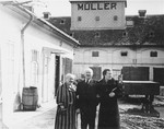 Portrait of the donor's in-laws in the courtyard of the warehouse bearing their name in Sered, Czechoslovakia.