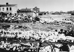 The abandoned property of Jews who have been deported from the Zychlin ghetto is piled in an open field.