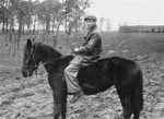 Amnon Klukowski, a member of the Hashomer Hatzair Zionist collective, rides the only horse on their farm in Zarki.