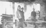 Three young Jews at a sawmill near the Wlodawa ghetto.
