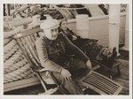 Jewish refugees from Vienna sit on the deck of the Conte Biancamano while en route to Shanghai.