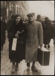 Suitcase in hand, Meir Orkin walks with his mother, Leiba, to the Bialystok train station, whence he will be departing for Palestine.